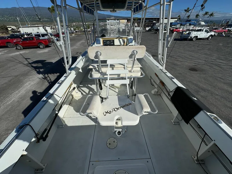 Slide: The Image of 1997 Shamrock 260 Open boat interior with fishing chair and equipment. - 12
