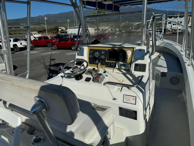 Slide: The Image of 1997 Shamrock 260 Open boat cockpit with steering wheel, controls, and navigation equipment. - 13