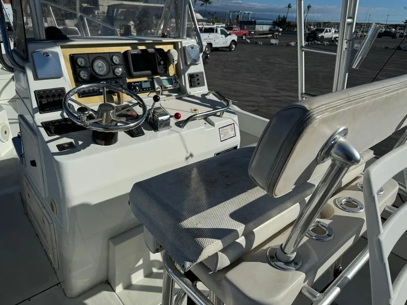 Slide: The Image of 1997 Shamrock 260 Open boat cockpit with steering wheel and control panel. - 15