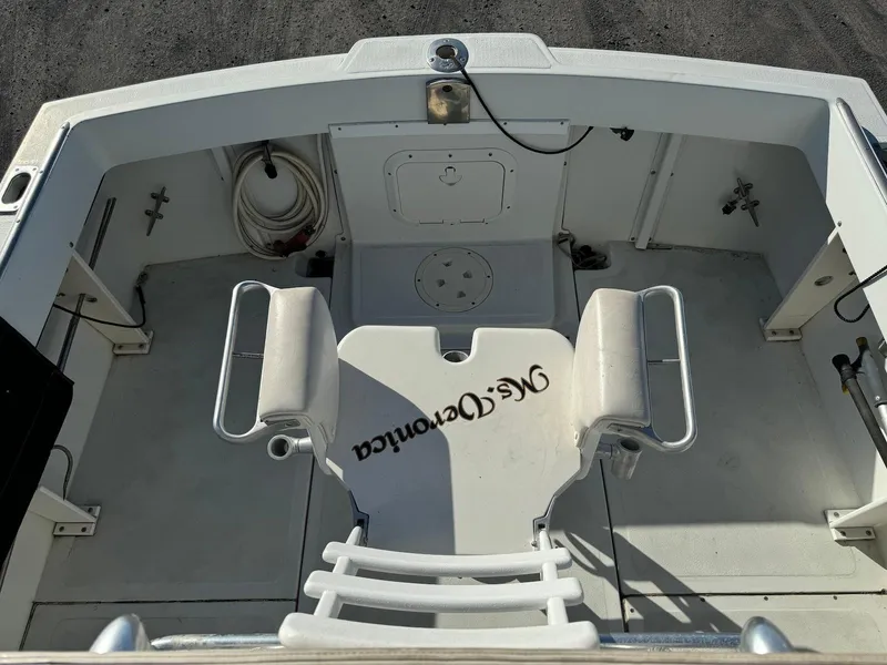 Slide: The Image of 1997 Shamrock 260 Open boat interior with seating and fishing equipment. - 16