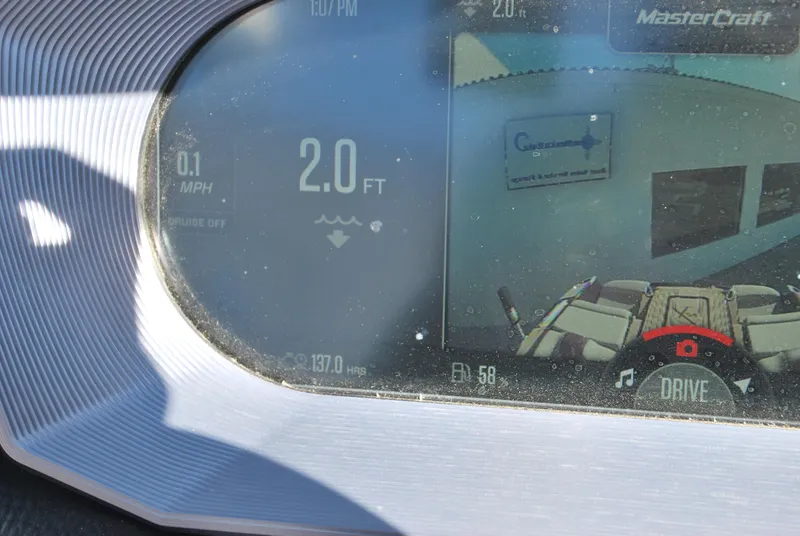 Slide: The Image of 2023 MasterCraft X24 dashboard display showing speed and depth readings. - 10