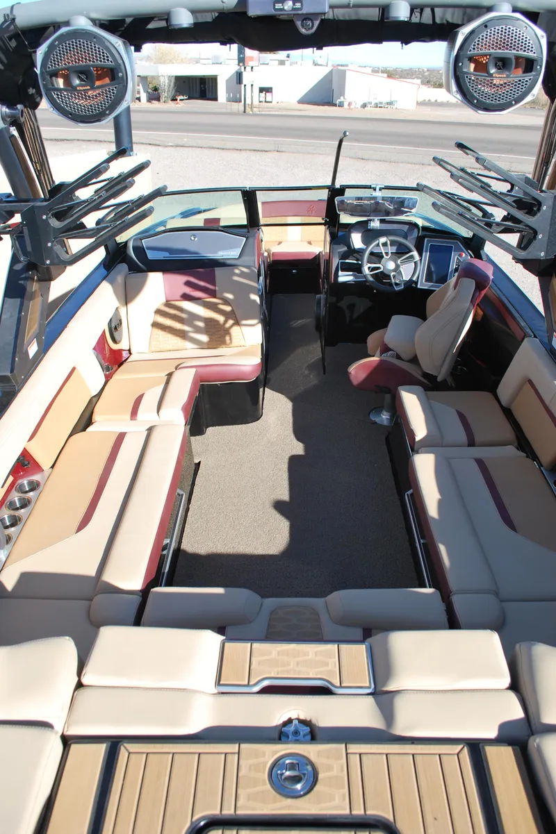Slide: The Image of 2023 MasterCraft X24 boat interior with spacious seating and modern design. - 16