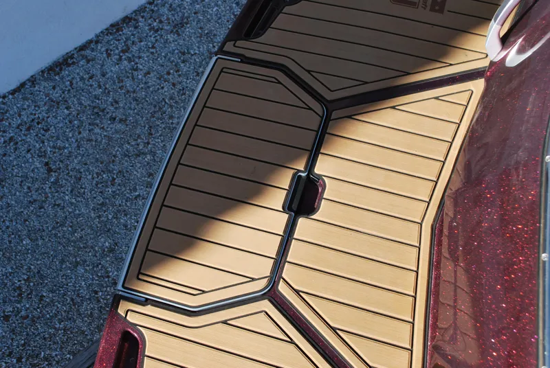 Slide: The Image of 2023 MasterCraft X24 boat deck with tan and black design. - 19