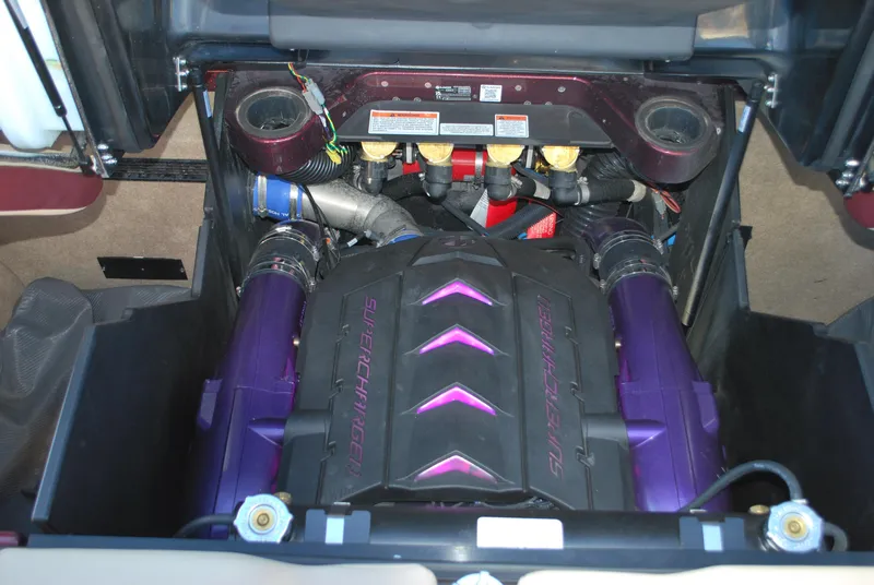 Slide: The Image of 2023 MasterCraft X24 engine compartment with supercharged engine components. - 21