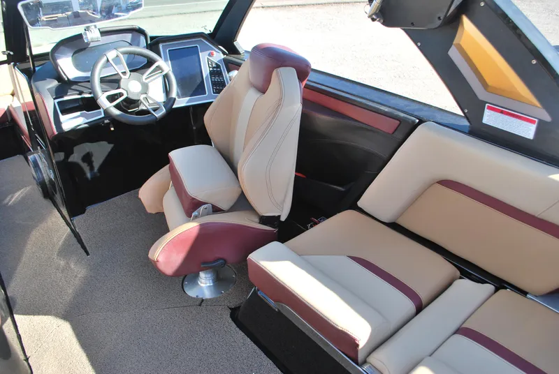 Slide: The Image of Interior of 2023 MasterCraft X24 boat with modern seating and steering console. - 9