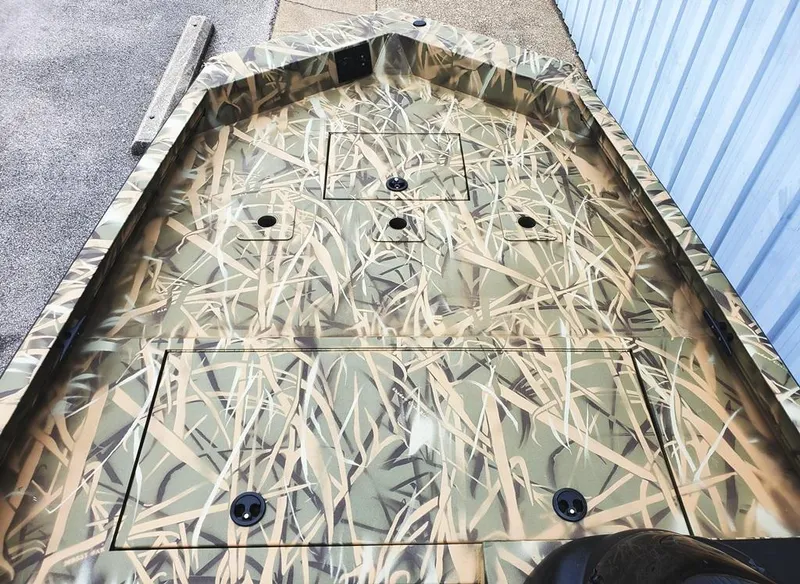 Slide: The Image of Bow casting deck with 3 across seat bases, aerated livewell & storage compartments under deck. - 4