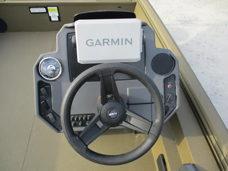 Slide: The Image of Avid 18 Rogue SC 2025 boat dashboard with Garmin navigation system and steering wheel. - 11