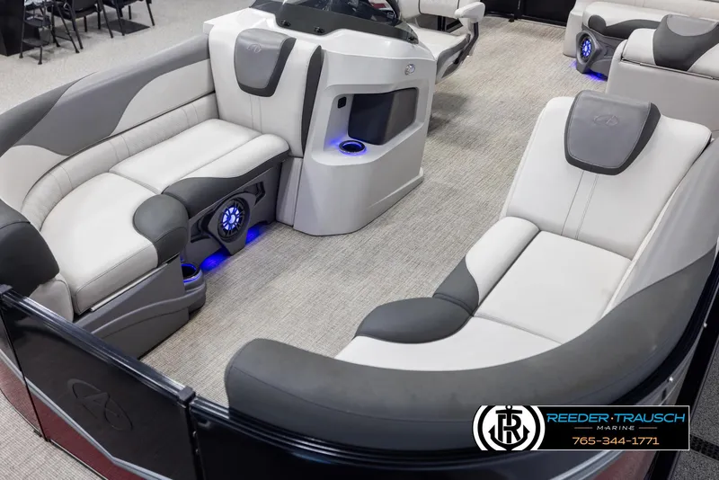 Slide: The Image of 2023 Avalon LSZ CRB pontoon boat interior with plush seating and blue LED lighting. - 10