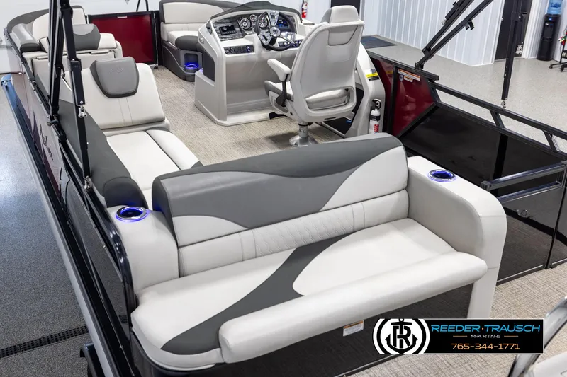 Slide: The Image of 2023 Avalon LSZ CRB boat interior with modern seating and steering console. - 11