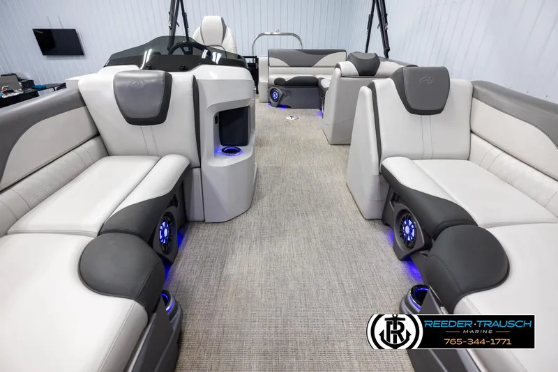 Slide: The Image of 2023 Avalon LSZ CRB boat interior with luxurious seating and ambient lighting. - 13