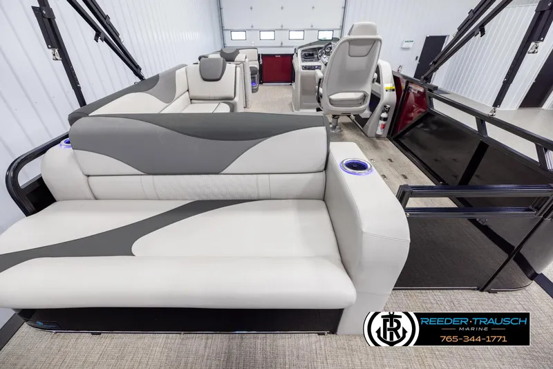 Slide: The Image of 2023 Avalon LSZ CRB boat interior with modern seating and steering console. - 16