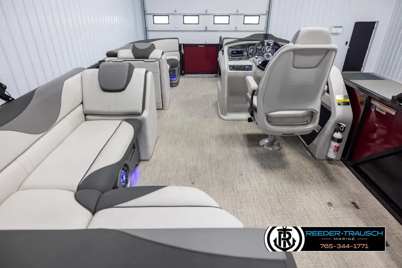 Slide: The Image of 2023 Avalon LSZ CRB pontoon boat interior with plush seating and modern helm. - 17