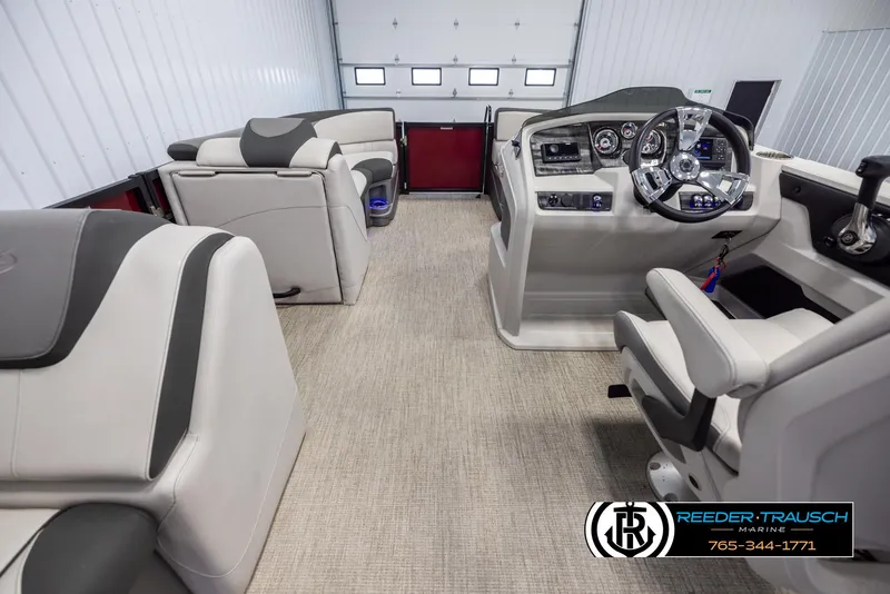 Slide: The Image of 2023 Avalon LSZ CRB boat interior with modern dashboard and seating. - 18