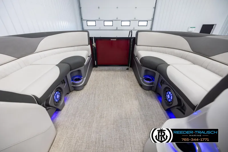 Slide: The Image of 2023 Avalon LSZ CRB boat interior with plush seating and LED lighting. - 19