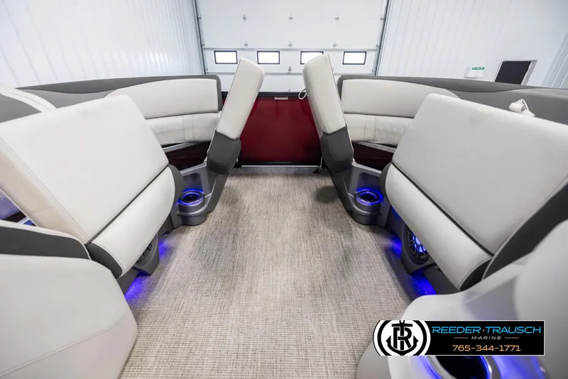 Slide: The Image of 2023 Avalon LSZ CRB boat interior with plush seating and ambient lighting. - 20