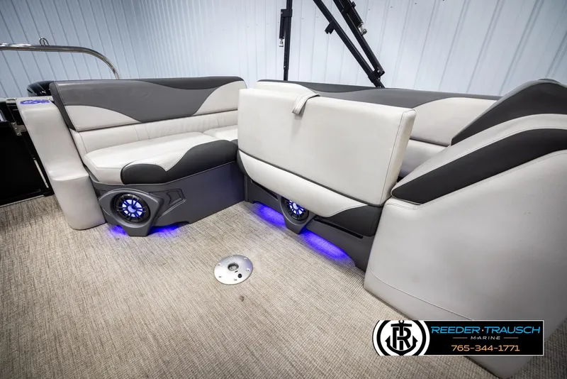 Slide: The Image of 2023 Avalon LSZ CRB boat interior with plush seating and blue LED lighting. - 25