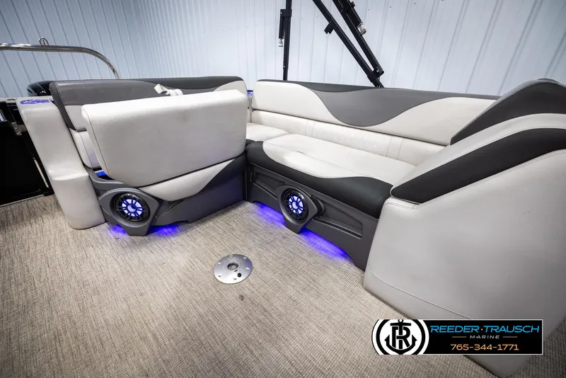 Slide: The Image of 2023 Avalon LSZ CRB boat interior with modern seating and blue LED lighting. - 26