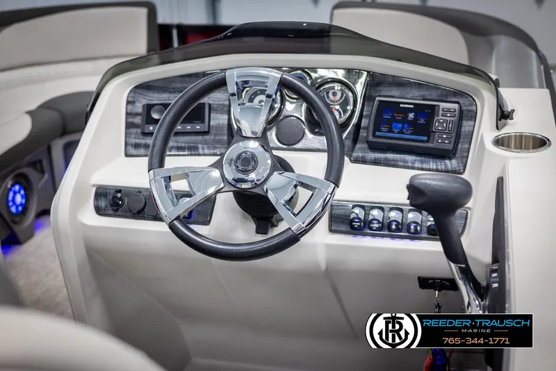 Slide: The Image of 2023 Avalon LSZ CRB boat dashboard with steering wheel and control panel. - 29