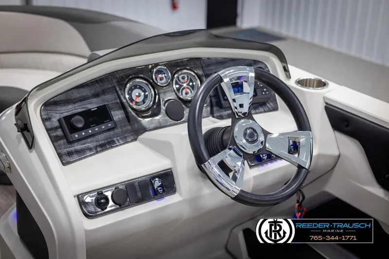 Slide: The Image of 2023 Avalon LSZ CRB boat dashboard with modern steering wheel and controls. - 30