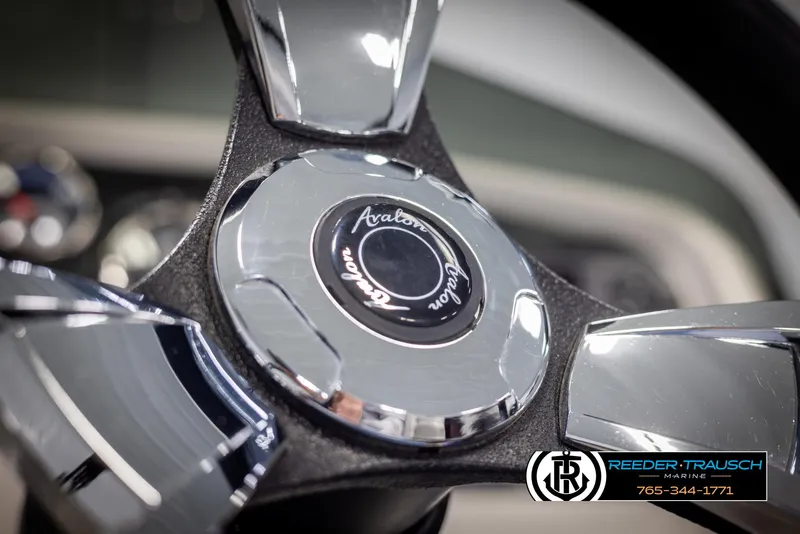 Slide: The Image of Close-up of 2023 Avalon LSZ CRB steering wheel with chrome accents. - 31