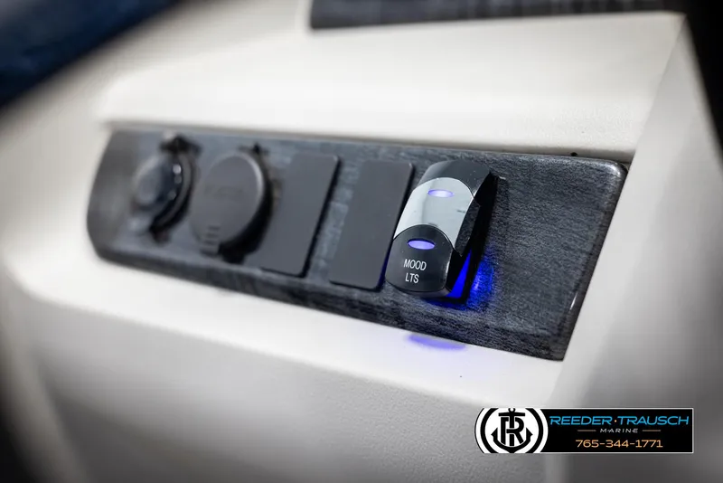Slide: The Image of Control panel of 2023 Avalon LSZ CRB boat with illuminated switches. - 32