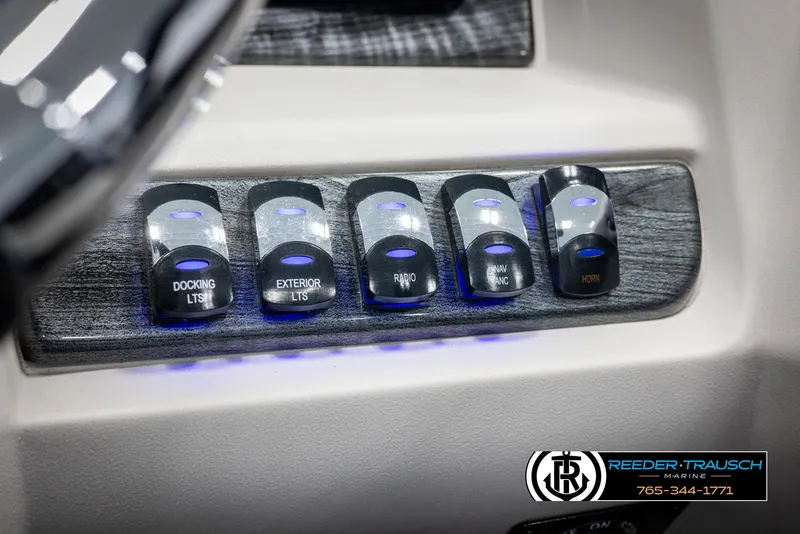 Slide: The Image of Control panel of 2023 Avalon LSZ CRB boat with illuminated switches. - 37