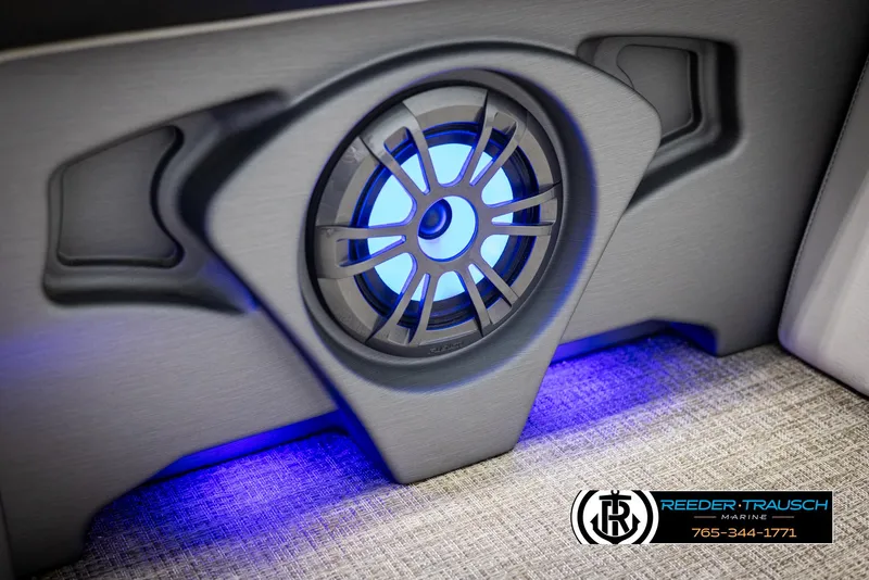 Slide: The Image of 2023 Avalon LSZ CRB speaker with blue LED lighting, Reeder-Trausch Marine logo. - 44