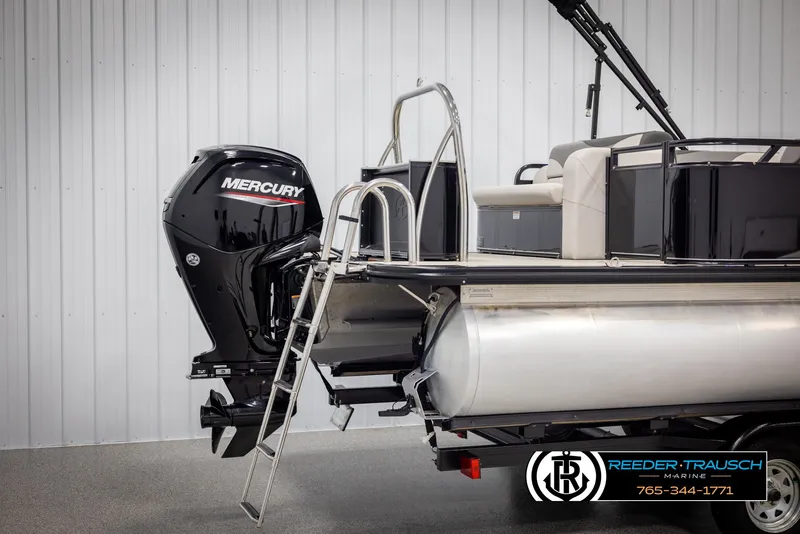 Slide: The Image of 2023 Avalon LSZ CRB pontoon boat with Mercury outboard motor and ladder. - 46