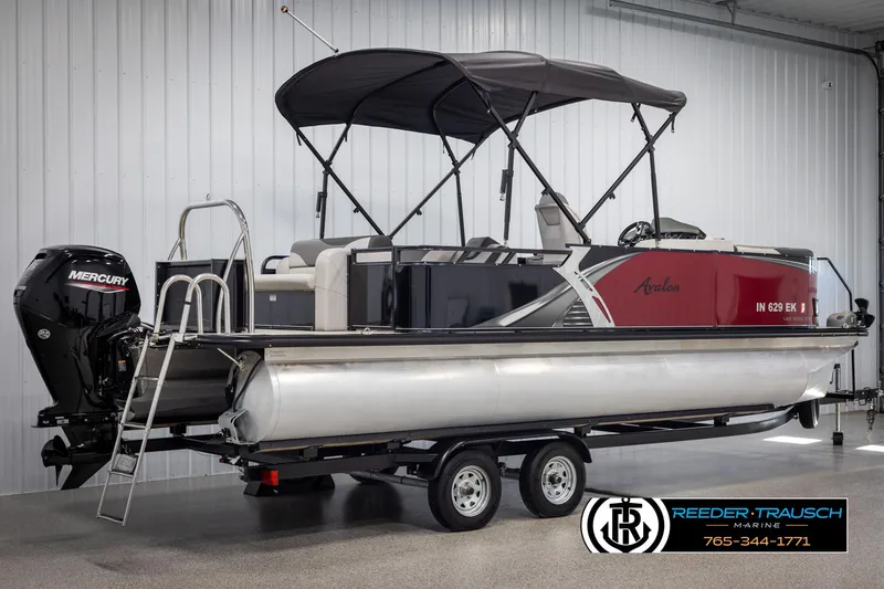 Slide: The Image of 2023 Avalon LSZ CRB pontoon boat on trailer in showroom. - 6