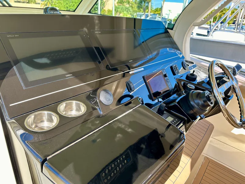Slide: The Image of Helm of 2019 Scout 380 LXF boat with modern controls and steering wheel. - 16