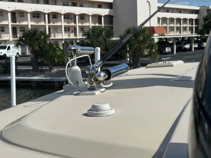 Slide: The Image of 2019 Scout 380 LXF boat deck with chrome fittings and antenna, dockside view. - 21