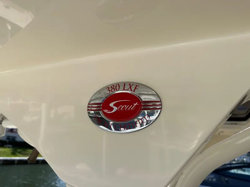 Slide: The Image of 2019 Scout 380 LXF boat emblem, featuring a red and silver design. - 4