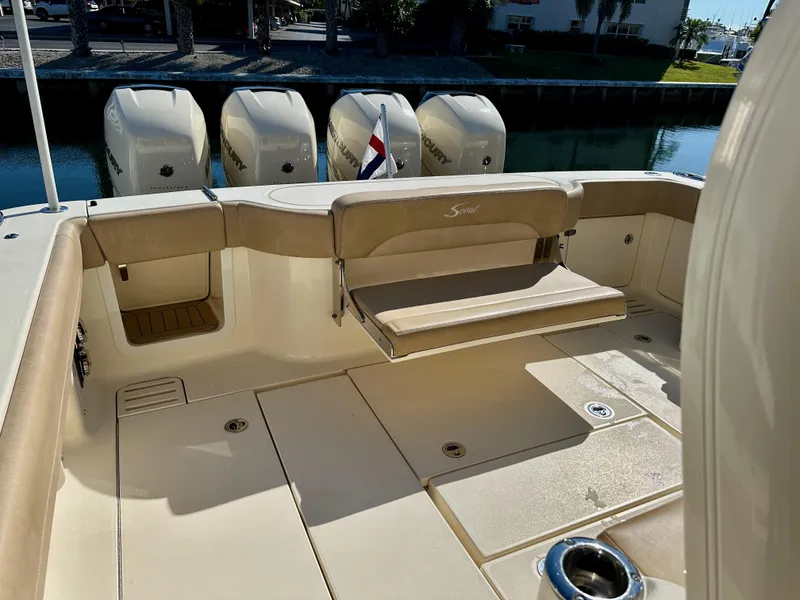 Slide: The Image of 2019 Scout 380 LXF boat with beige seating and multiple outboard engines. - 9