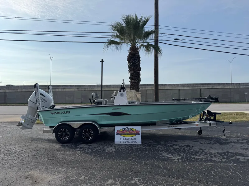 The Image of 2025 Vexus ACX 2210 boat on trailer, parked outdoors near palm tree. - 1