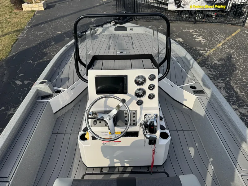 Slide: The Image of 2025 Vexus ACX 2210 boat console with steering wheel and control panel. - 11