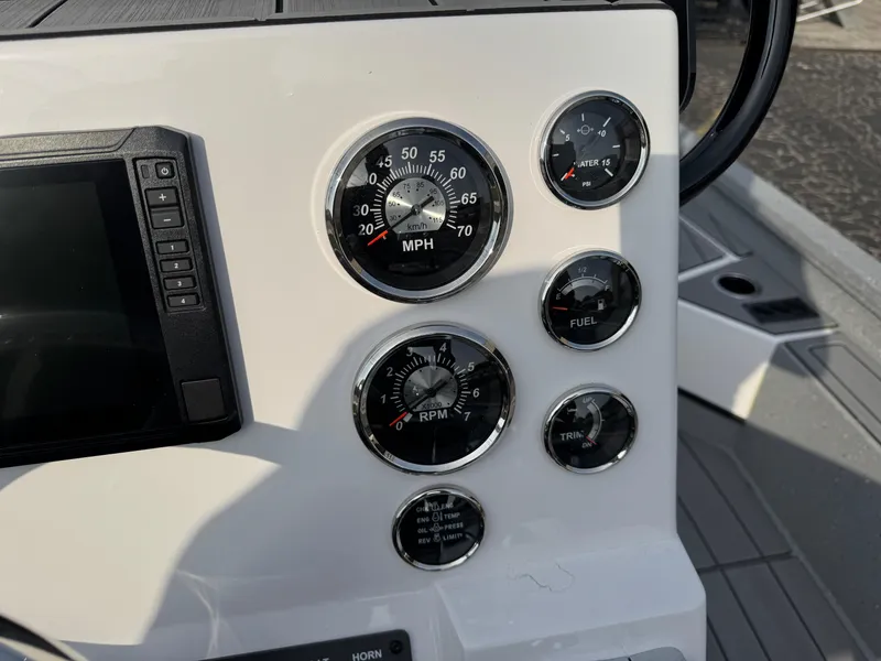 Slide: The Image of Dashboard of 2025 Vexus ACX 2210 boat with speedometer, RPM, and fuel gauges. - 13