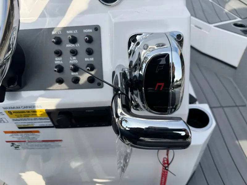 Slide: The Image of Close-up of 2025 Vexus ACX 2210 boat control panel and throttle lever. - 14