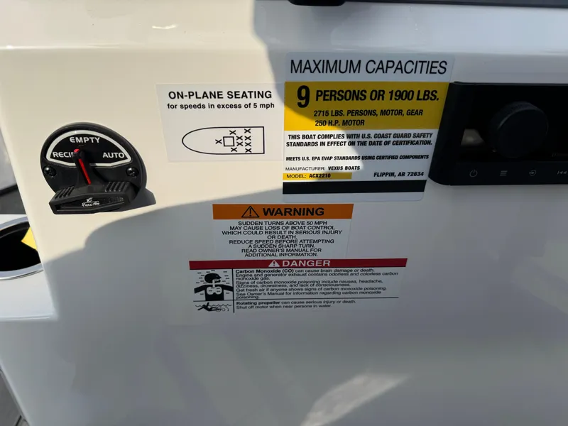 Slide: The Image of Vexus ACX 2210 boat capacity and safety labels, 2025 model. - 16