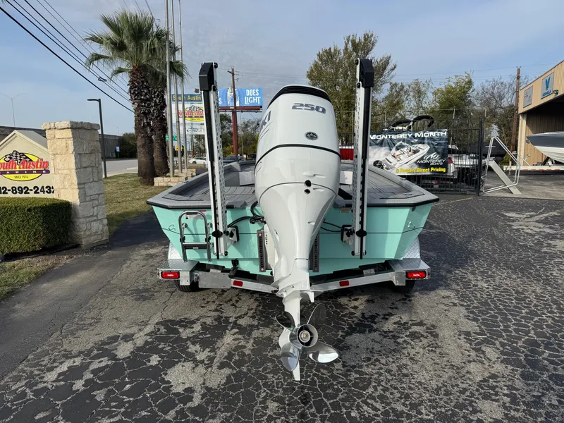 Slide: The Image of 2025 Vexus ACX 2210 boat with powerful outboard motor on a trailer. - 2