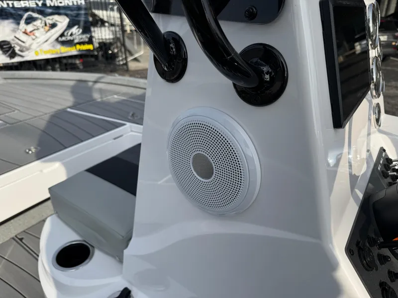 Slide: The Image of 2025 Vexus ACX 2210 boat console with speaker and seating detail. - 20