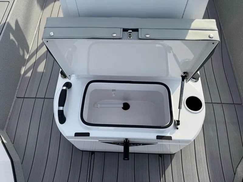 Slide: The Image of Open storage compartment on 2025 Vexus ACX 2210 boat with cup holder. - 22