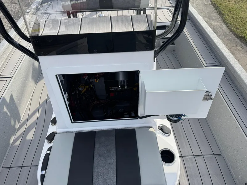 Slide: The Image of 2025 Vexus ACX 2210 boat interior with open storage compartment and seating. - 23