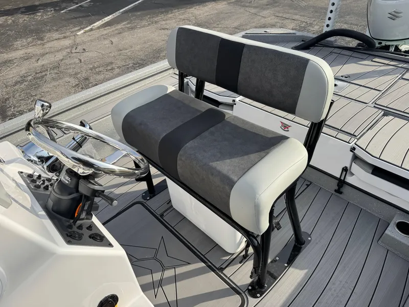 Slide: The Image of 2025 Vexus ACX 2210 boat interior with gray seating and steering console. - 26