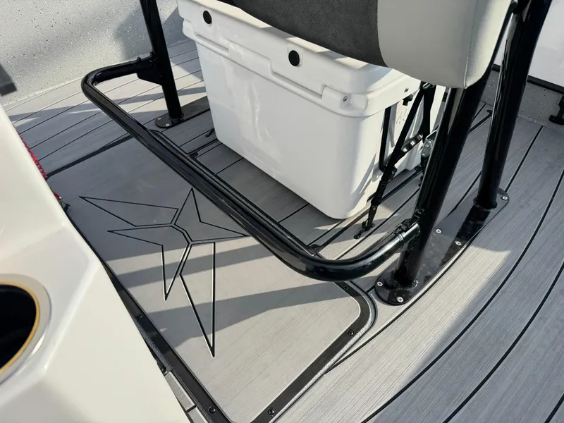 Slide: The Image of Vexus ACX 2210 boat interior, featuring a cooler and star design on the deck, 2025 model. - 27