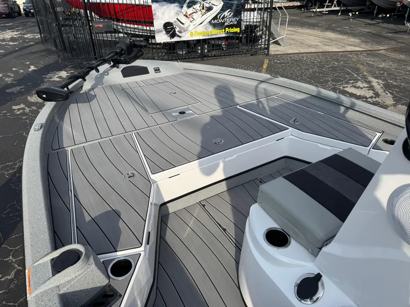 Slide: The Image of 2025 Vexus ACX 2210 boat deck with sleek gray design and seating area. - 29