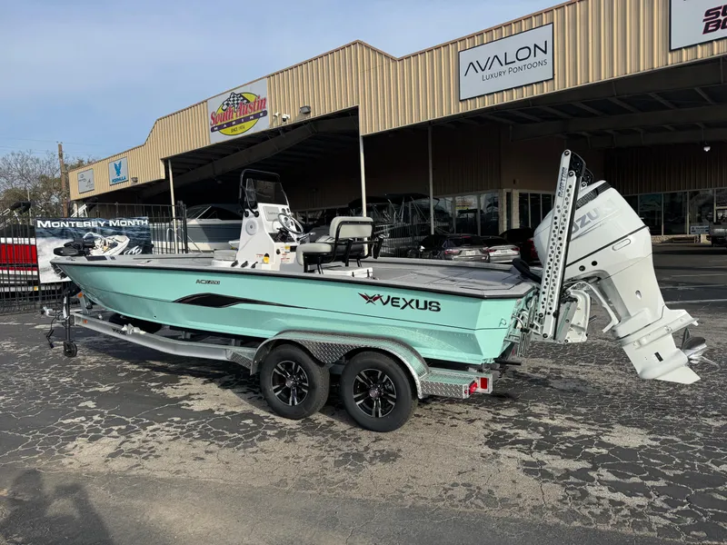 Slide: The Image of 2025 Vexus ACX 2210 boat on trailer outside dealership. - 3