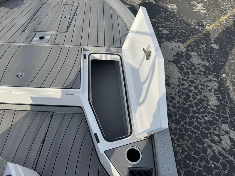 Slide: The Image of Vexus ACX 2210 boat deck with open storage compartment, 2025 model. - 32