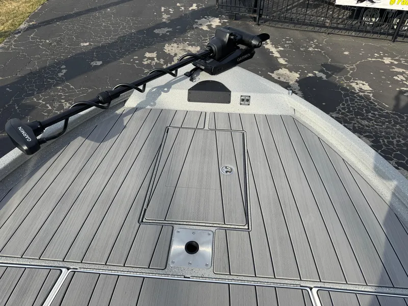 Slide: The Image of 2025 Vexus ACX 2210 boat deck with trolling motor, featuring sleek gray design. - 33