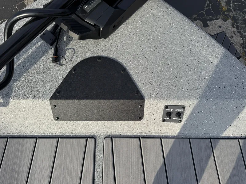 Slide: The Image of 2025 Vexus ACX 2210 boat deck with control panel and textured surface. - 36