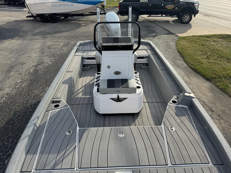 Slide: The Image of 2025 Vexus ACX 2210 boat with sleek deck design and modern features. - 37